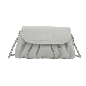 Chic mint green pleated crescent bag with chain strap and elegant flap design