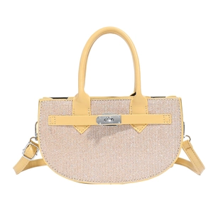 Elegant semi-circular glitter handbag in pale gold with silver twist lock and shoulder strap