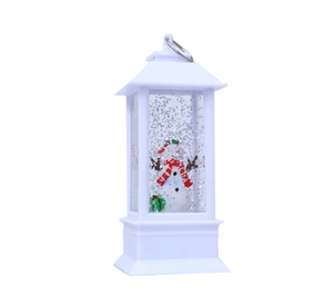 Dettaglio della lanterna di Natale LED bianca con pupazzo di neve e glitter scintillanti