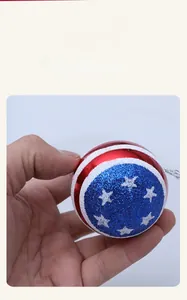 Detailed view of red and blue glitter Christmas ornaments with white stars and silver strings