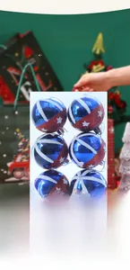 Detail of glittery red and blue star pattern Christmas balls on a festive background