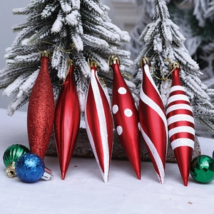Set of six red spindle-shaped Christmas tree ornaments with festive glitter patterns