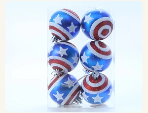 Detail of six red white and blue star and stripe pattern Christmas ornaments in clear box