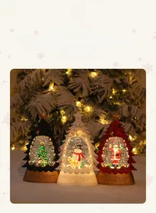 Detail of Christmas tree water lantern with glittering sequins and Santa Claus figure