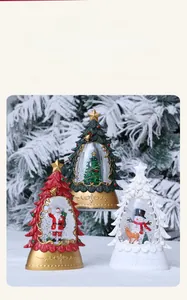 Christmas tree snow globe lantern set with swirling snow and festive glowing light