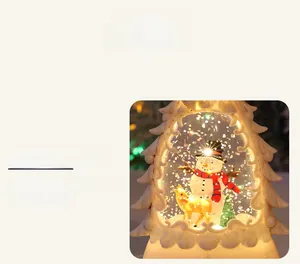 Macro shot of liquid-filled Christmas tree lantern with festive snowman and reindeer scene