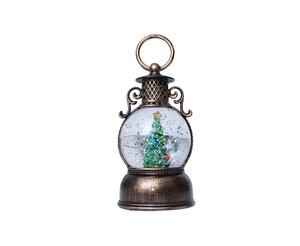 Détail d'une lanterne de Noël vintage en bronze avec sapin miniature et liquide pailleté