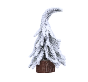 Détail d'un mini cèdre de Noël floqué avec pointe courbée sur un socle en bois naturel