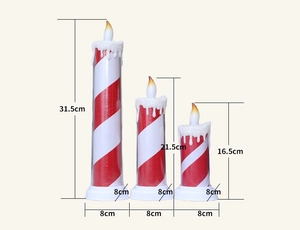 Three LED Christmas pillar candles in red and white stripes with varying heights and dimensions