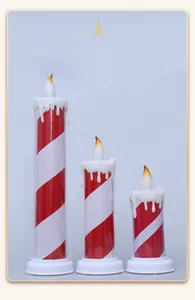 Three-piece set of LED Christmas pillar candles with red and white candy cane stripes