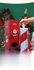 Close-up of LED Christmas candle with red stripes and festive gift box with CE mark