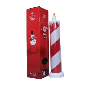 Detail of red striped LED candles with a Merry Christmas gift box and Santa motifs
