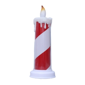Detail of red and white spiral LED candle with realistic dripping wax and flame wick