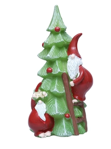 Detail of resin climbing Santa gnomes on a green Christmas tree with a brown ladder