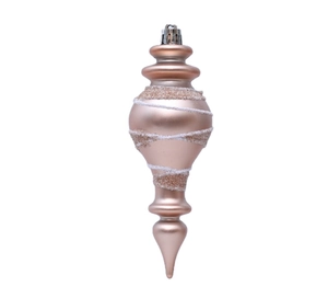 Macro shot of rose gold spindle Christmas ornament with white spiral glitter patterns