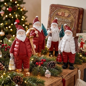 Set of 4 festive resin Santa Claus figurines with ski and gift bag Christmas decorations