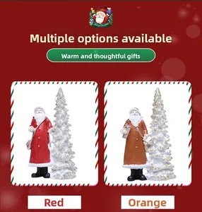 Close-up of Santa Claus resin ornaments with glowing trees in red and orange colors