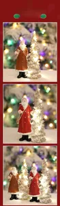 Detailed view of LED lighted Christmas tree with miniature Santa Claus resin figurines