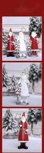 Close-up of Santa resin ornament holding golden star with miniature Christmas tree