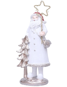Detail of Santa figurine in white robe holding golden star scepter with mini Christmas tree