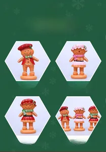 Dettaglio di figurine di pan di zenzero in resina con abiti natalizi e finitura opaca
