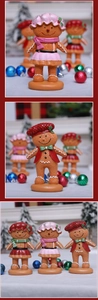 Detailed close-up of Christmas gingerbread man resin ornaments with cookie texture finish