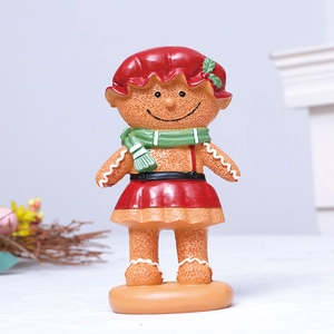 Charming resin gingerbread girl statue with red skirt and green scarf for Xmas decor