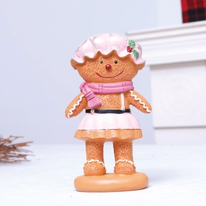 Cartoon gingerbread man resin ornament wearing pink outfit for Christmas window decoration