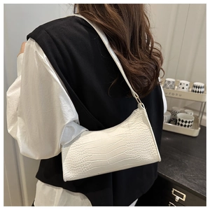 Chic white crocodile pattern shoulder bag shown in a stylish home interior lifestyle setting