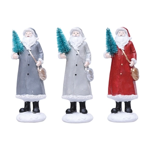 Three-piece set of resin Santa figurines with green trees on white snowy bases