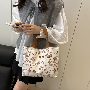 Graffiti printed canvas tote bag with brown handles, large capacity shoulder bag for women