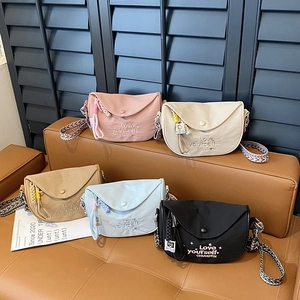 Minimalist canvas crossbody bags with CHUUDON embroidery and colorful woven straps