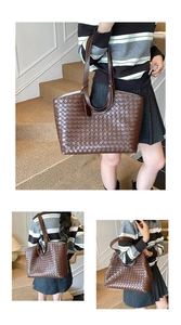 Detailed view of dark brown woven leather tote with dual straps in a lifestyle setting