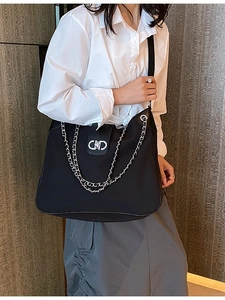Classic black soft leather tote bag with stylish gold chain and metal CD buckle decoration