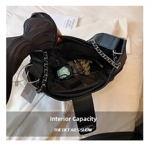 Interior view of black leather tote bag showing large capacity and zipper pocket