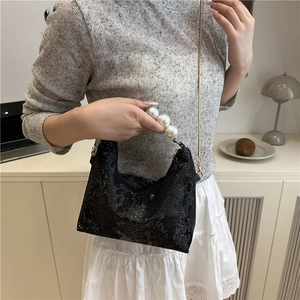 Black snake pattern bag with oversized pearl handle and gold chain strap for women