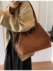 Dark brown woven leather tote bag with Intrecciato pattern and wide shoulder strap
