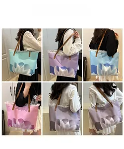 Multiple views of large canvas tote bags with gradient patterns and tassel details