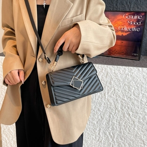 Elegant black quilted leather crossbody bag with geometric square buckle for women