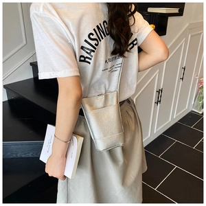 Silver metallic mini bucket bag with textured faux leather and slim crossbody strap