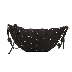 Minimalist black crescent shoulder bag with white bow prints and knot strap detail