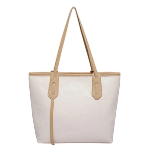 Large capacity beige tote bag with embossed patterns and light brown handles for women