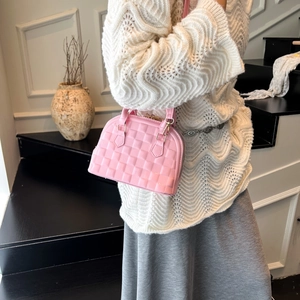 Pink shell handbag with textured faux leather finish and top handle for women