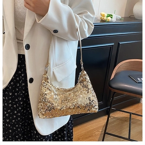 Close-up of gold sequined shoulder bag featuring reflective texture and party elegance