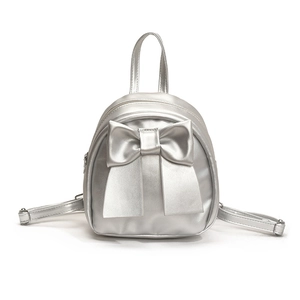 Silver mini backpack featuring a stylish large bow design and metallic leather finish
