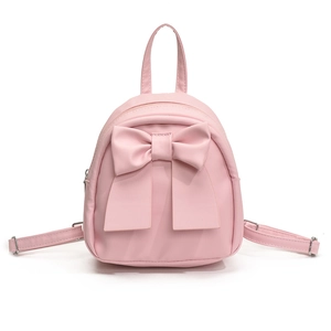 Pink mini backpack with bow detail, versatile top handle and adjustable straps