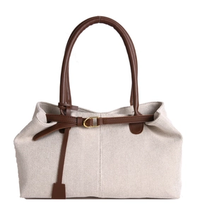 Vintage cream canvas hobo bag with dark brown leather straps and gold metal buckle