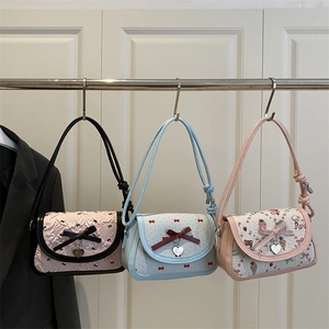 Three stylish bow shoulder bags in pink floral, blue plaid, and cartoon dessert prints