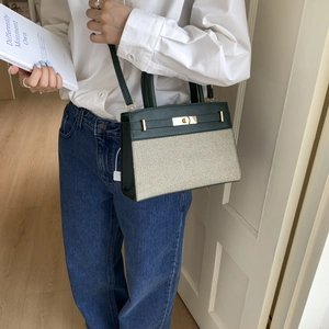 Minimalist color block crossbody bag in dark green leather and cream woven fabric