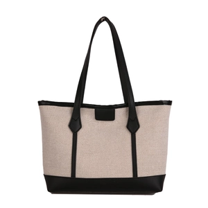 Large contrast canvas tote bag with black leather trim and long shoulder straps